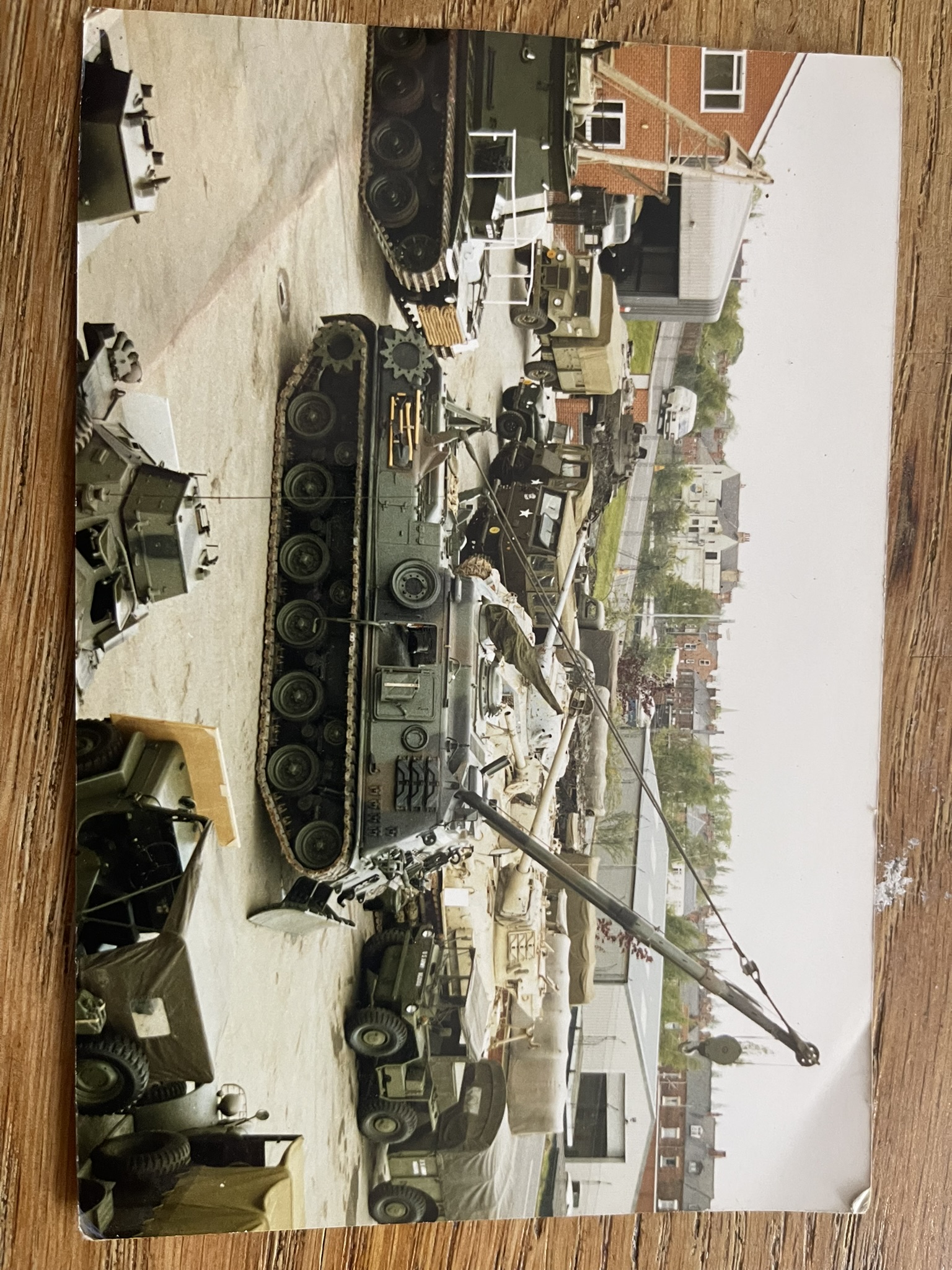 Military vehicles including tracked and wheeled vehicles in the Budge collection yard.