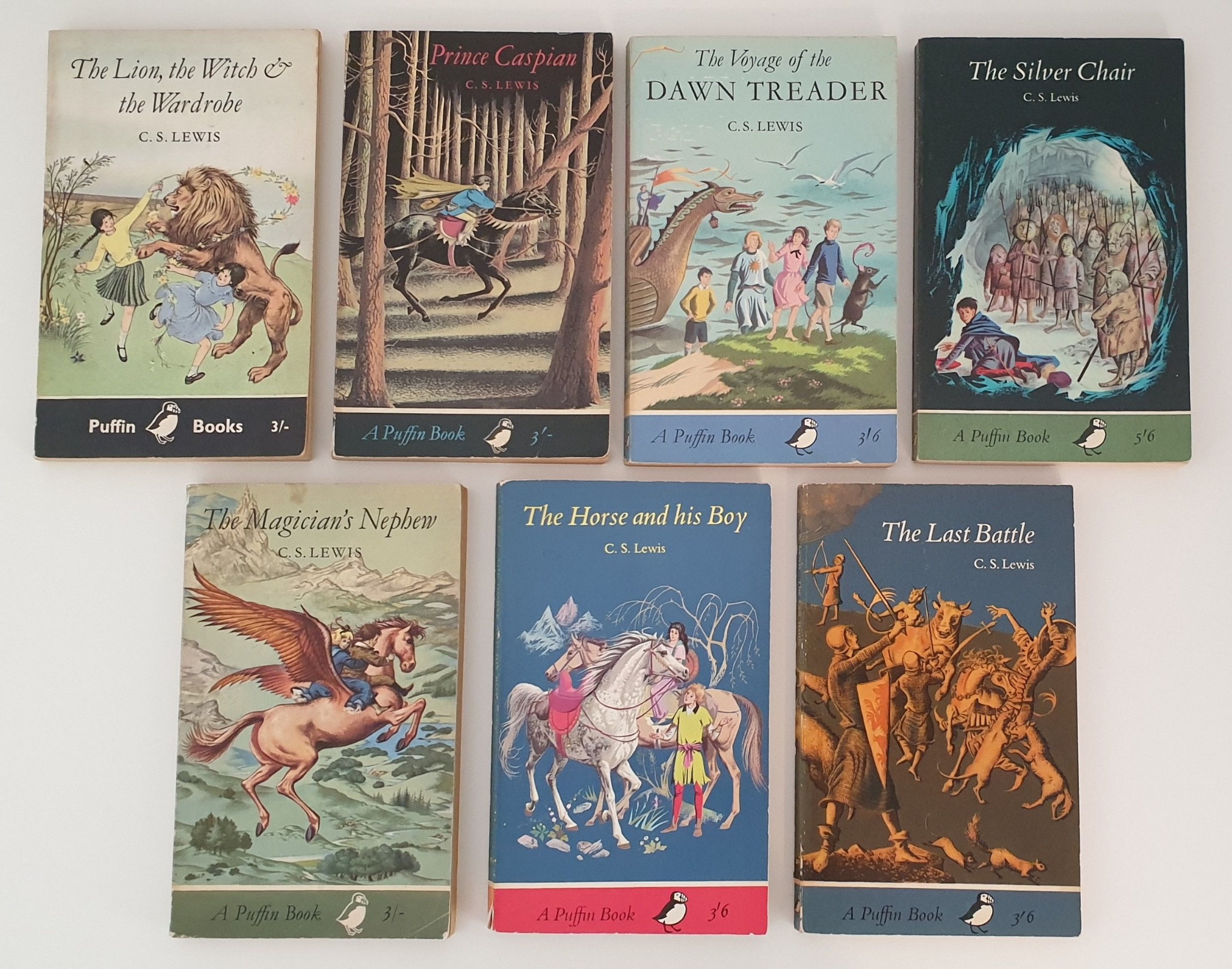 Seven vintage Puffin editions of The Chronicles of Narnia, matching the editions remembered from childhood.