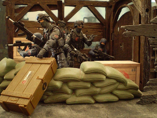 Image direction: a deliberate army-building display - repeated Stormtroopers, Cobra soldiers, Foot Soldiers or another generic troop type arranged as a coherent scene rather than random duplicates.