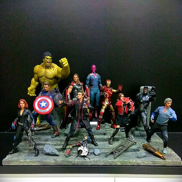 Image direction: a collector using figures creatively - articulated comic photography, diorama, staged action scene or carefully posed display where the collection becomes raw material for another activity.