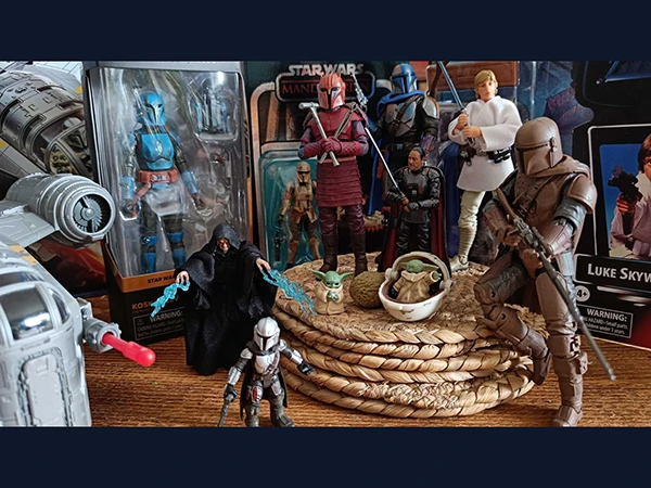 Hero image direction: a visually strong group showing the same collecting world in different states - one carded vintage figure, one loose articulated figure with accessories, and one modern collector release. Avoid a generic wall of boxed toys.