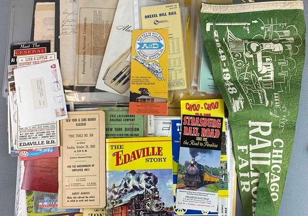 Hero image direction: a visually coherent spread of real ephemera with obvious variety in function and scale - a ticket, menu, trade card, timetable, programme, label and receipt. It should feel like surviving evidence rather than a decorative collage of vintage paper.