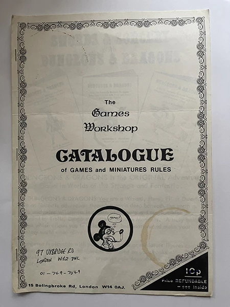 Image direction: a used paper object whose handling is visibly integral to its meaning - a punched railway ticket, folded event programme, travelled commercial cover, annotated menu or stamped admission piece.