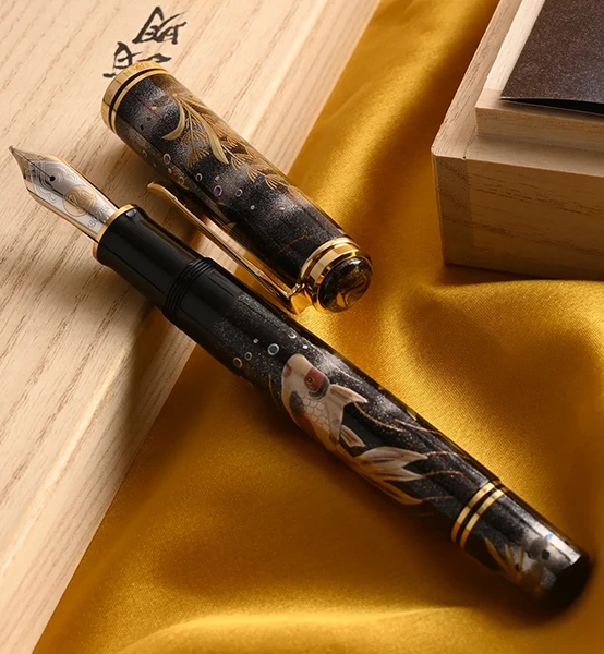 Image direction: a high-quality Japanese lacquer fountain pen showing maki-e, urushi, raden or chinkin detail. Prefer an image where the artisan technique is legible rather than a generic luxury product shot.