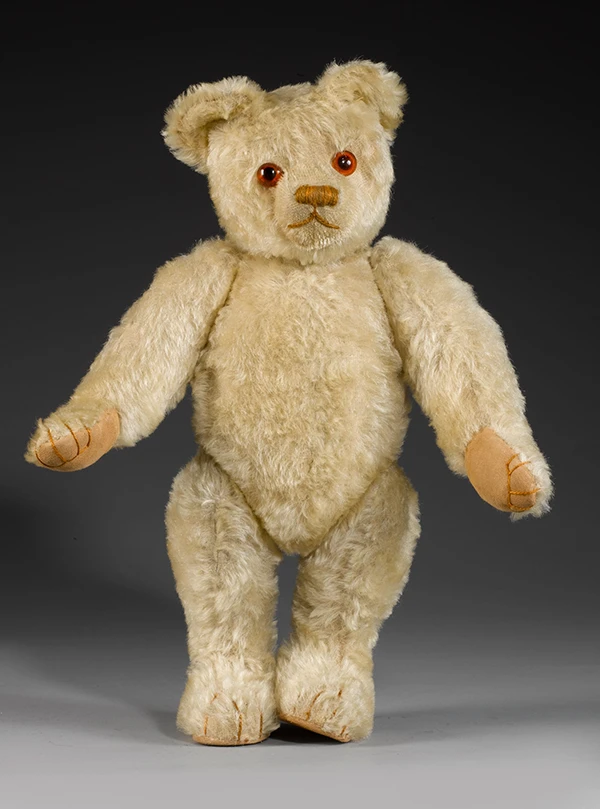 Image direction: a strong contemporary artist bear with obvious authorship - distinctive face, materials, posture or sculptural treatment. Prefer a named maker's work over a generic handmade teddy.