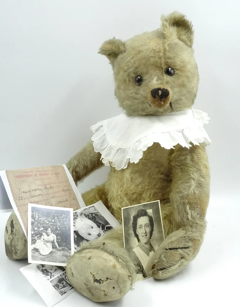 Image direction: a named historic bear shown with documentary material - ideally a period photograph, owner image, letter, label or auction catalogue that demonstrably connects the individual bear to its biography.