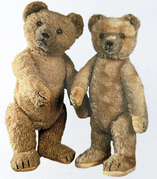 Image direction: two examples from the same maker or model with noticeably different faces. The point is expression, not dramatic condition difference. A crop that makes eye position, muzzle and stitching easy to compare would be ideal.