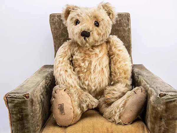 A collection of antique and modern teddy bears from different makers and periods.